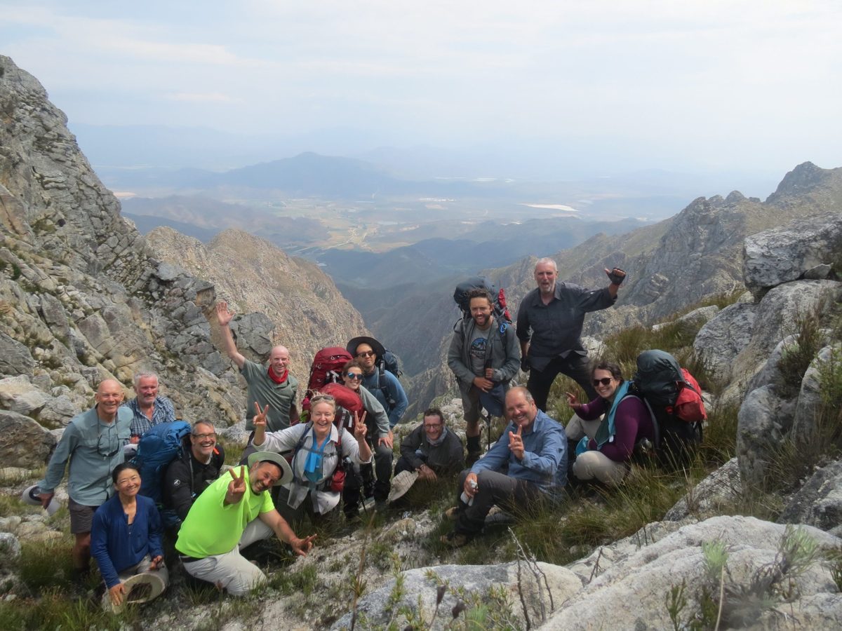 Rim of Africa hiking group together on a rocky mountain pass